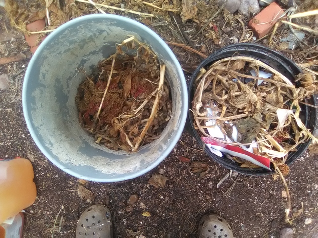 Brown material bottom of 5 gal. bucket keeps lip of black soaker on bucket edge. Brown material bottom of 5 gal. bucket keeps lip of black soaker on bucket edge.